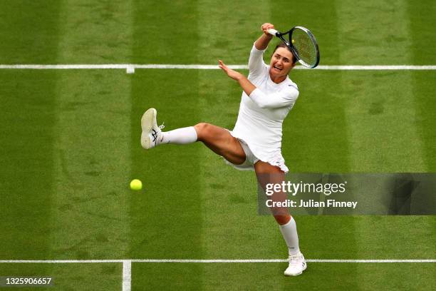 Monica Niculescu of Romania plays a forehand volley in her Ladies' Singles First Round match against Aryna Sabalenka of Belarus during Day One of The...