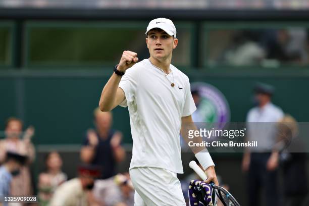 Jack Draper of Great Britain celebrates after winning the first set in his Men's Singles First Round match against Novak Djokovic of Serbia during...