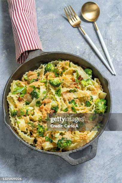 pasta with broccoli chili flakes  breadcrumbs - breadcrumb stock pictures, royalty-free photos & images