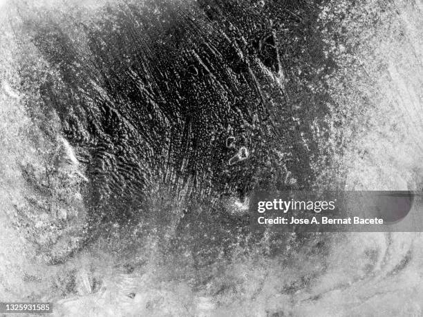 full frame of an outdoor semi-transparent smooth ice surface. - frost stock photos et images de collection