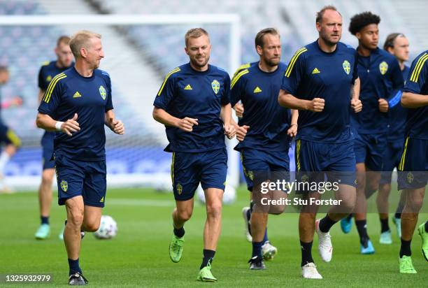 Sebastian Larsson of Sweden warms up with teammates during the Sweden Training Session ahead of the UEFA Euro 2020 Round of 16 match between Sweden...