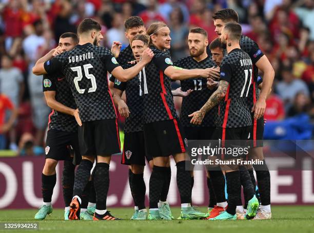 Players of Croatia celebrate their side's first goal, an own goal by Unai Simon of Spain during the UEFA Euro 2020 Championship Round of 16 match...