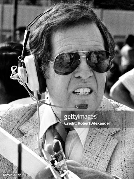 Bill France Jr., the CEO of NASCAR, supervises infield activities prior to the start of the 1984 Daytona 500 stock car race at Daytona International...