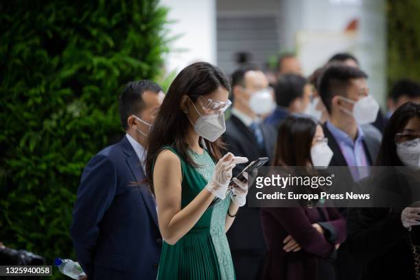 An attendee uses her mobile phone at the 14th edition of the Mobile World Congress at Fira de Barcelona's Gran Via venue in L'Hospitalet de...