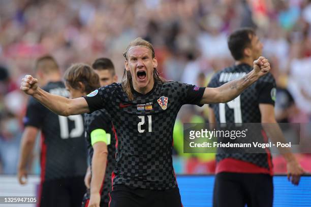 Domagoj Vida of Croatia celebrates their side's third goal scored by team mate Mario Pasalic during the UEFA Euro 2020 Championship Round of 16 match...