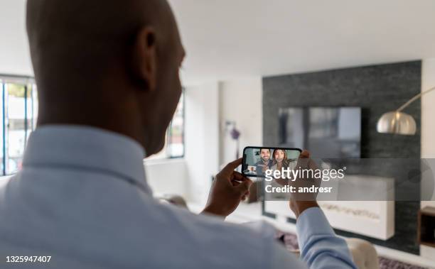 real estate agent making a virtual tour of a house on his cell phone - virtual visit stock pictures, royalty-free photos & images