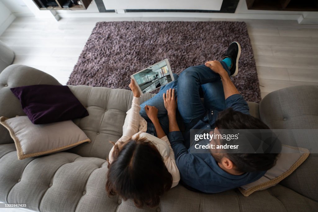 Couple on a video call with their Real Estate Agent and taking a virtual tour of a house for sale