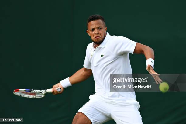 Jay Clarke of Great Britain plays a forehand in his Men's Singles First Round match against Egor Gerasimov of Belarus during Day One of The...