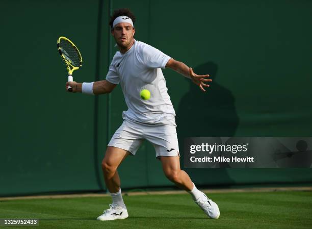 Marco Cecchinato of Italy plays a forehand in his Men's Singles First Round match against Liam Broady of Great Britain during Day One of The...