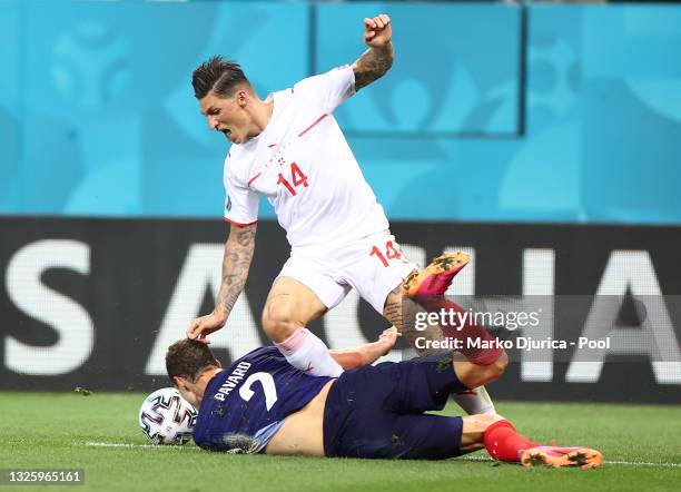 Steven Zuber of Switzerland is fouled by Benjamin Pavard of France leading to a penalty being awarded after a VAR review during the UEFA Euro 2020...