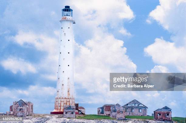View of the Great Isaac Lighthouse , along with several abandoned buildings, Great Isaac Cay, Bimini, Bahamas, June 1996.