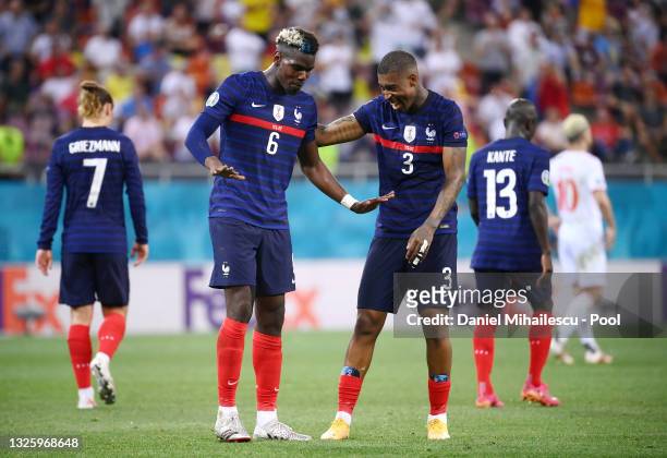 Paul Pogba of France celebrates with Presnel Kimpembe after scoring their side's third goal during the UEFA Euro 2020 Championship Round of 16 match...