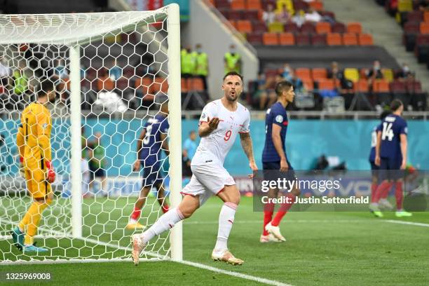 Haris Seferovic of Switzerland celebrates after scoring their side's second goal during the UEFA Euro 2020 Championship Round of 16 match between...