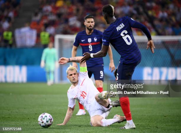 Paul Pogba of France is challenged by Granit Xhaka of Switzerland during the UEFA Euro 2020 Championship Round of 16 match between France and...