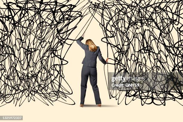 woman attempts to push through troubles - overcome fear stock pictures, royalty-free photos & images