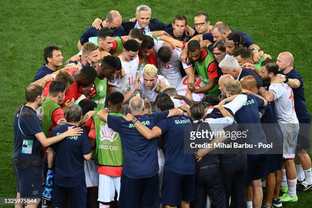 Granit Xhaka of Switzerland encourages the team before the penalty shoot out in the UEFA Euro 2020 Championship Round of 16 match between France and...