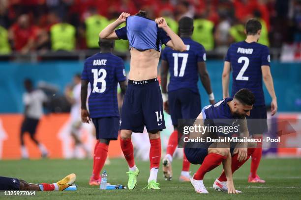 Adrien Rabiot and Olivier Giroud of France look dejected after team mate Kylian Mbappe misses their side's decisive penalty during the UEFA Euro 2020...