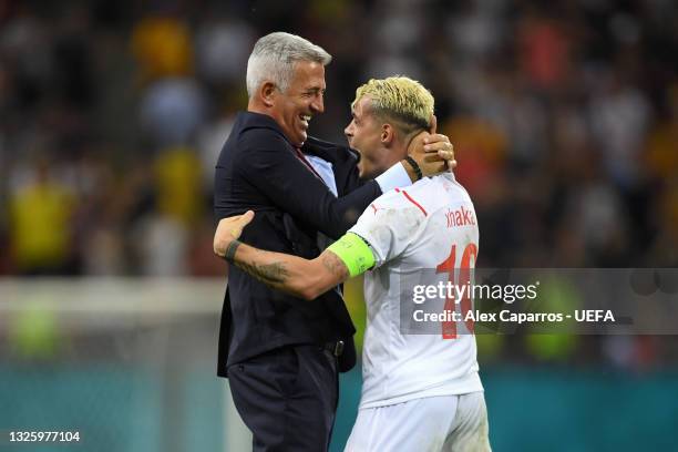 Vladimir Petkovic, Head Coach of Switzerland celebrates with Granit Xhaka of Switzerland after victory in the penalty shoot out in the UEFA Euro 2020...