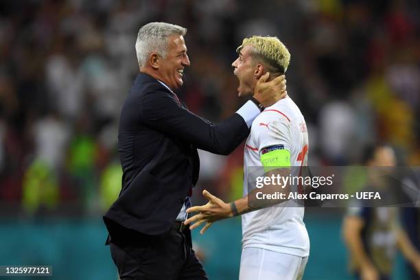 Vladimir Petkovic, Head Coach of Switzerland celebrates with Granit Xhaka of Switzerland after victory in the penalty shoot out in the UEFA Euro 2020...