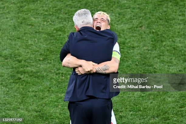 Vladimir Petkovic, Head Coach of Switzerland celebrates with Granit Xhaka of Switzerland after victory in the penalty shoot out in the UEFA Euro 2020...