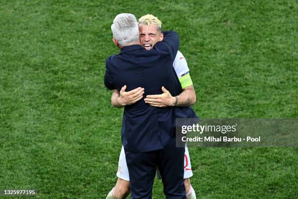 Vladimir Petkovic, Head Coach of Switzerland celebrates with Granit Xhaka of Switzerland after victory in the penalty shoot out in the UEFA Euro 2020...