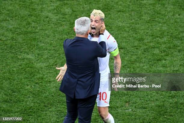 Vladimir Petkovic, Head Coach of Switzerland celebrates with Granit Xhaka of Switzerland after victory in the penalty shoot out in the UEFA Euro 2020...