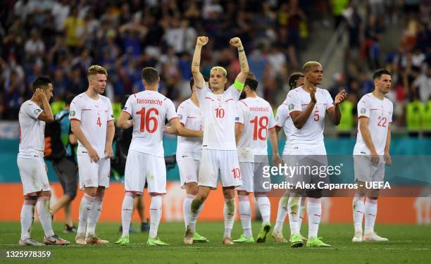 Granit Xhaka of Switzerland celebrates with teammates in the penalty shoot out during the UEFA Euro 2020 Championship Round of 16 match between...