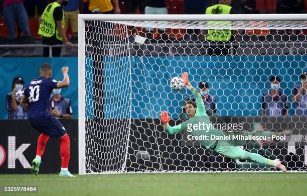 Yann Sommer of Switzerland saves the France fifth and decisive penalty taken by Kylian Mbappe during the UEFA Euro 2020 Championship Round of 16...