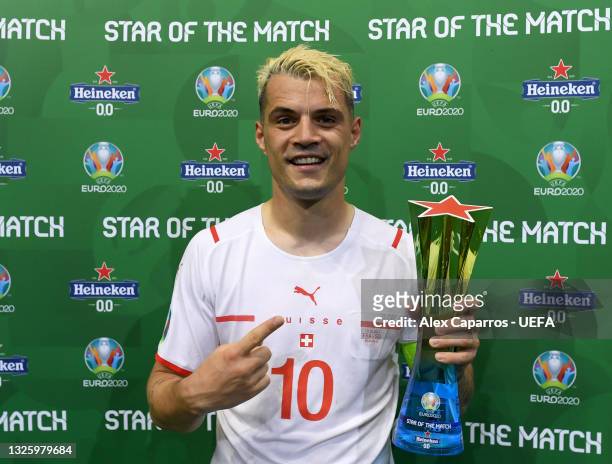 Granit Xhaka of Switzerland poses for a photograph with their Heineken "Star of the Match" award after the UEFA Euro 2020 Championship Round of 16...