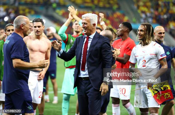 Vladimir Petkovic, Head Coach of Switzerland reacts with a member of coaching staff after the UEFA Euro 2020 Championship Round of 16 match between...