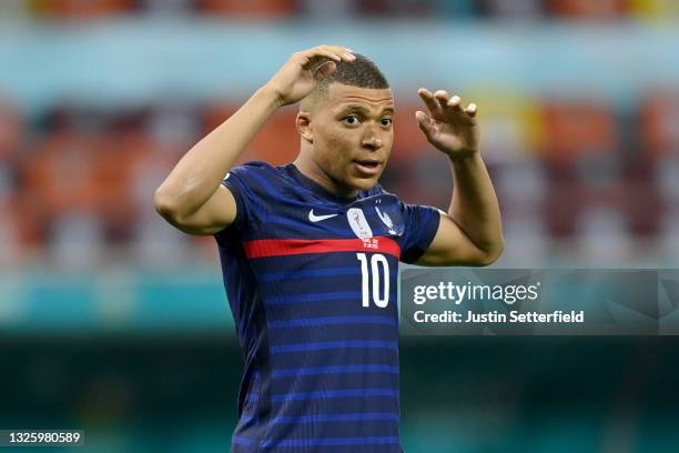 Kylian Mbappe of France reacts after having their side's decisive penalty saved by Yann Sommer of Switzerland in the penalty shoot out after the UEFA...