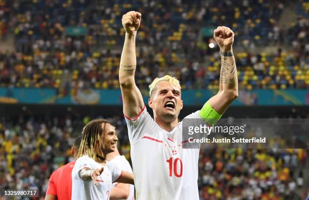 Granit Xhaka of Switzerland celebrates their side's victory in the penalty shoot out after the UEFA Euro 2020 Championship Round of 16 match between...