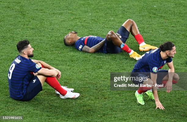 Olivier Giroud, Presnel Kimpembe and Adrien Rabiot of France look dejected after losing in the penalty shoot out in the UEFA Euro 2020 Championship...