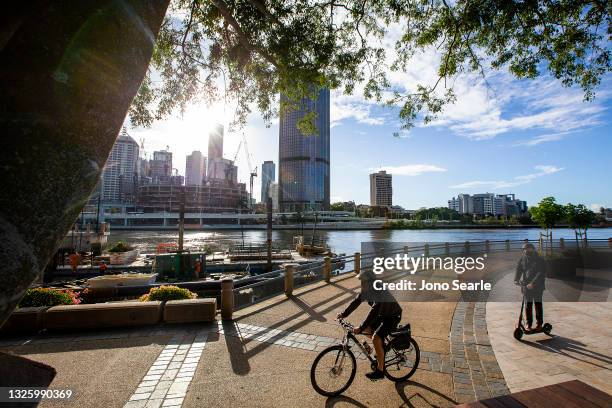 People wear masks at Southbank, on June 29, 2021 in Brisbane, Australia. New restrictions have come into effect across parts of Queensland as of 1 am...