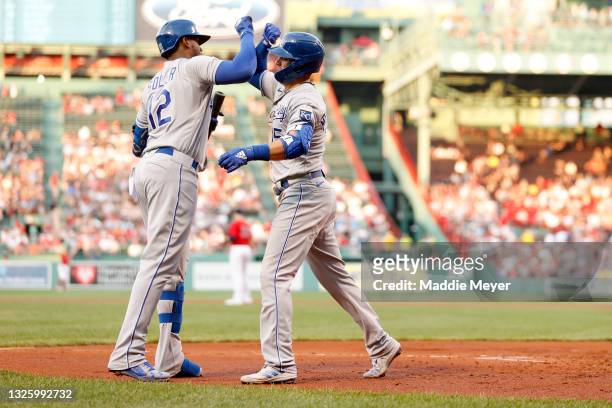 Whit Merrifield of the Kansas City Royals celebrates with Jorge Soler of the Kansas City Royals after hitting a home run against the Boston Red Sox...