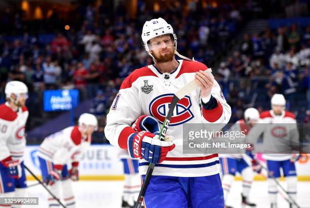 Eric Staal of the Montreal Canadiens looks at his stick during warm ups before Game One of the 2021 Stanley Cup Final against the Tampa Bay Lightning...