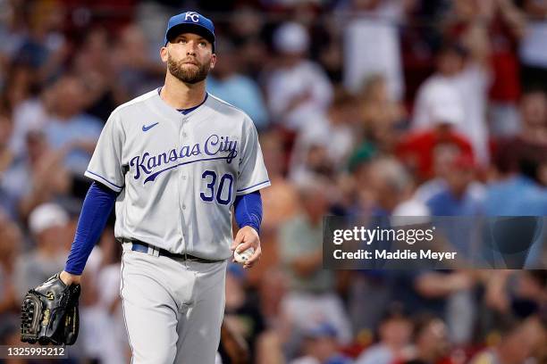 Danny Duffy of the Kansas City Royals reacts after Hunter Renfroe of the Boston Red Sox hit a two run home run during the fourth inning at Fenway...