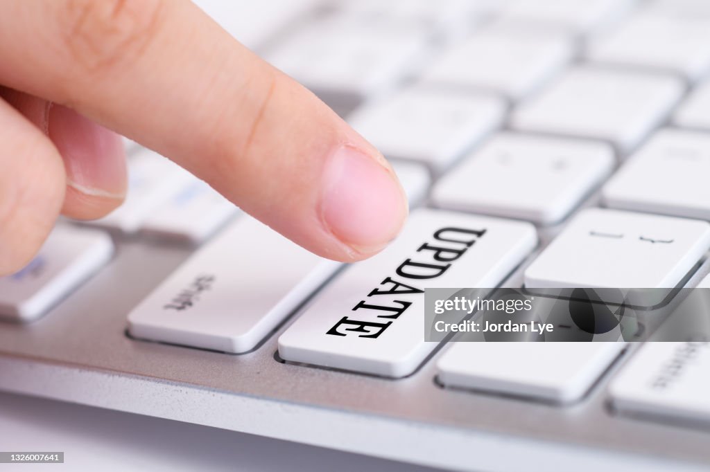 Close-Up Of Update Text On White Keyboard