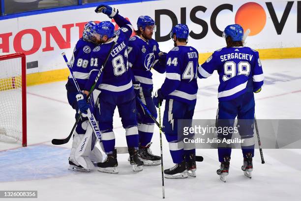 The Tampa Bay Lightning celebrate their 5-1 win against the Montreal Canadiens in Game One of the 2021 NHL Stanley Cup Final at Amalie Arena on June...