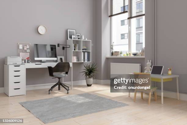 working at home concept during covid-19 pandemic. home office interior organized for working in the same room with parents and child - empty small office stock pictures, royalty-free photos & images