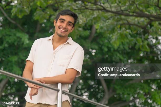 fit natural young male portrait of casual smiling at guayaquil, ecuador - malecon stock pictures, royalty-free photos & images