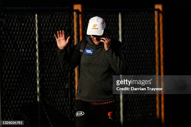 Leon Cameron, Senior Coach of the Giants is seen speaking on the phone during a GWS Giants AFL training session at Punt Road Oval on June 29, 2021 in...