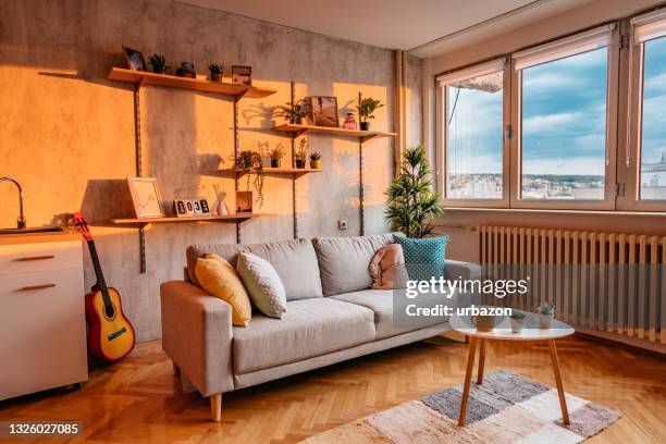 modern living room interior - home golden hour stock pictures, royalty-free photos & images