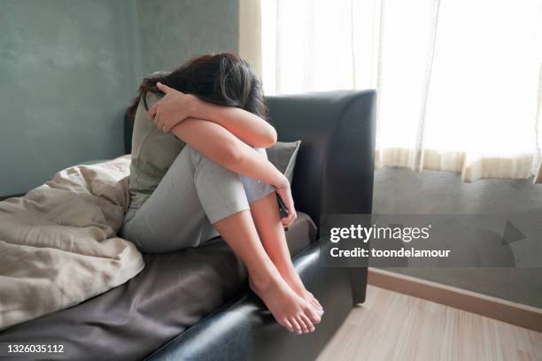 asia woman feeling sad in the bedroom. - anorexie stock pictures, royalty-free photos & images