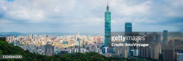 taipei skyscrapers towering over crowded cityscape aerial panorama taiwan - taipei 101 stock pictures, royalty-free photos & images