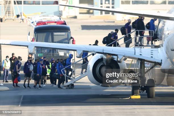 Fremantle Dockers and West Coast Eagles players, staff and families board a shared chartered flight to Melbourne ahead of round 16 of the AFL season,...