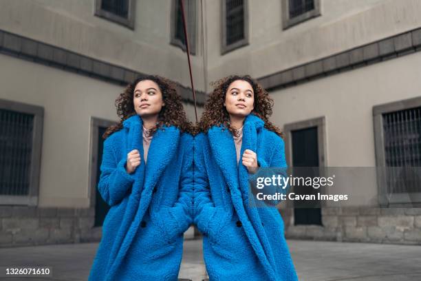 stylish young woman in the city - blue coat stock pictures, royalty-free photos & images