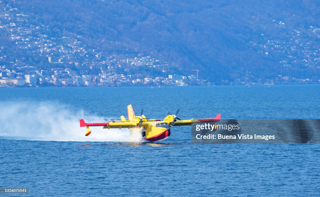 Fire extinguisher airplane loading water in a lake