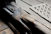 Long years of operation walking across the wooden threshold to the house caused the frame to abrade deep into the wood. only knot protrudes due to durability and hardness