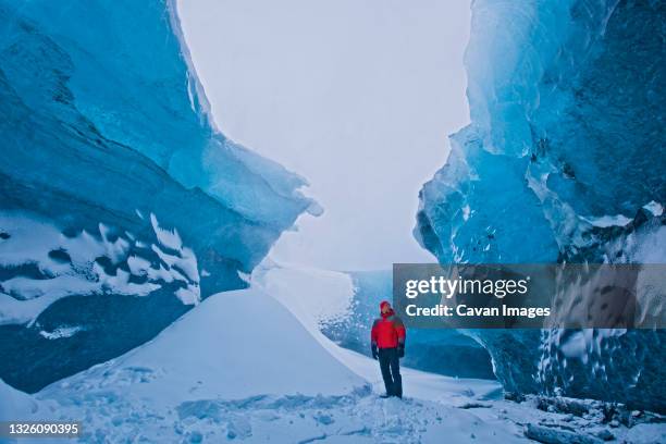 exploring an icecave under vatnajokull - europe's biggest glacier - potholing stock pictures, royalty-free photos & images